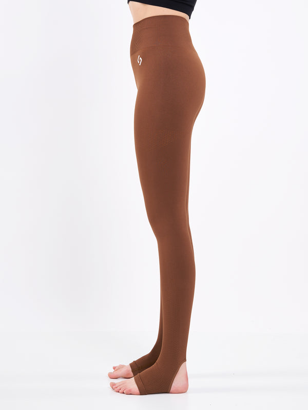 Color_Leather Brown | A Woman Wearing Toffee Color Seamless High-Waist Anti-Slip Yoga Leggings. Super Flexible
