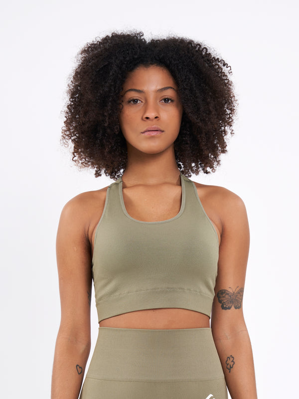 Color_Olive Branch | A Woman Wearing Olive Color Zen Perfect Seamless Mid-Impact Sports Bra With Padding