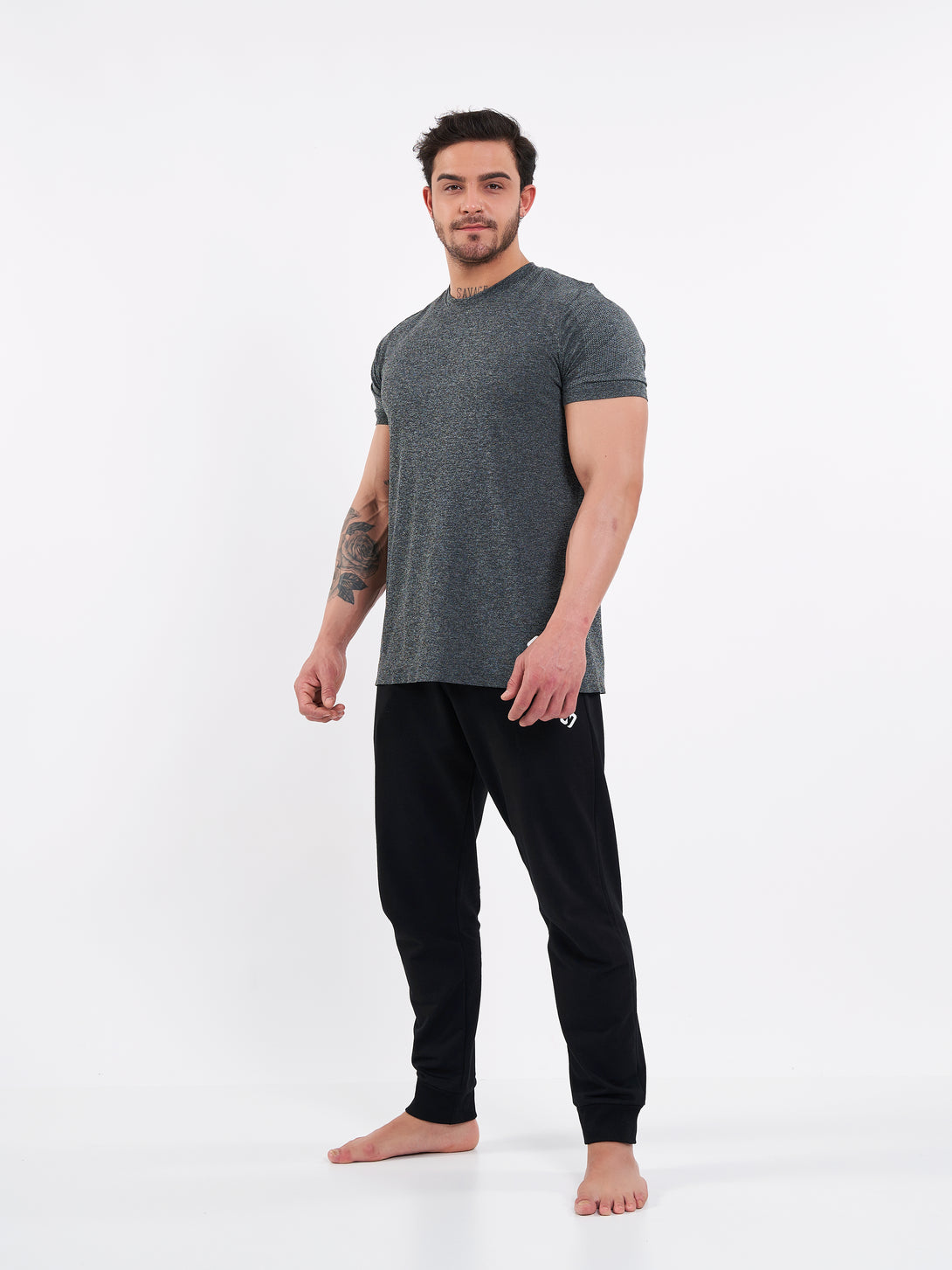 A Man Wearing Deep Black Color Men's Essential Comfort Joggers. Regular Fit