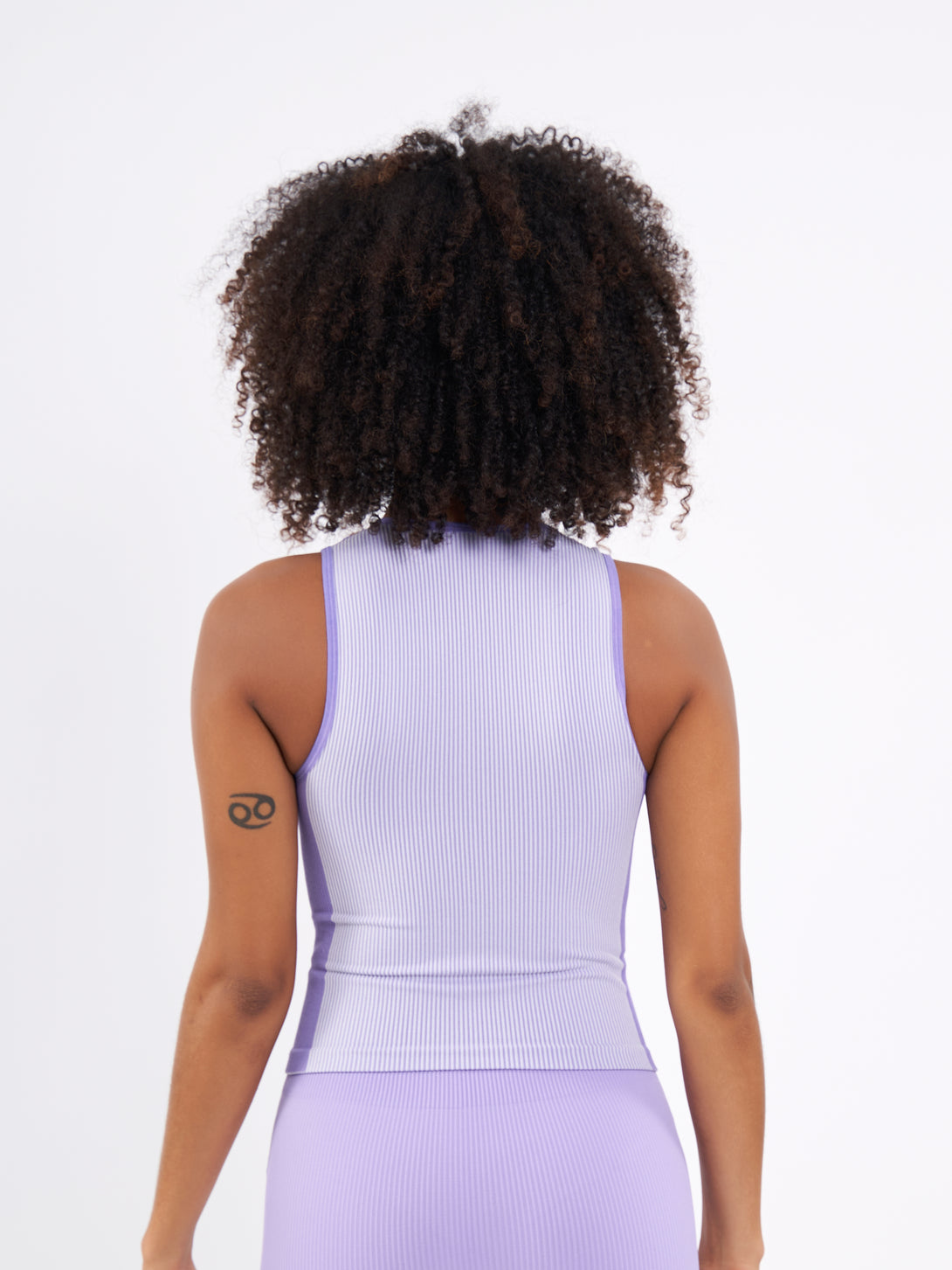 A Woman Wearing Paisley Purple Color Easy-Move Seamless Ribbed Crop Top for All-Day Wear