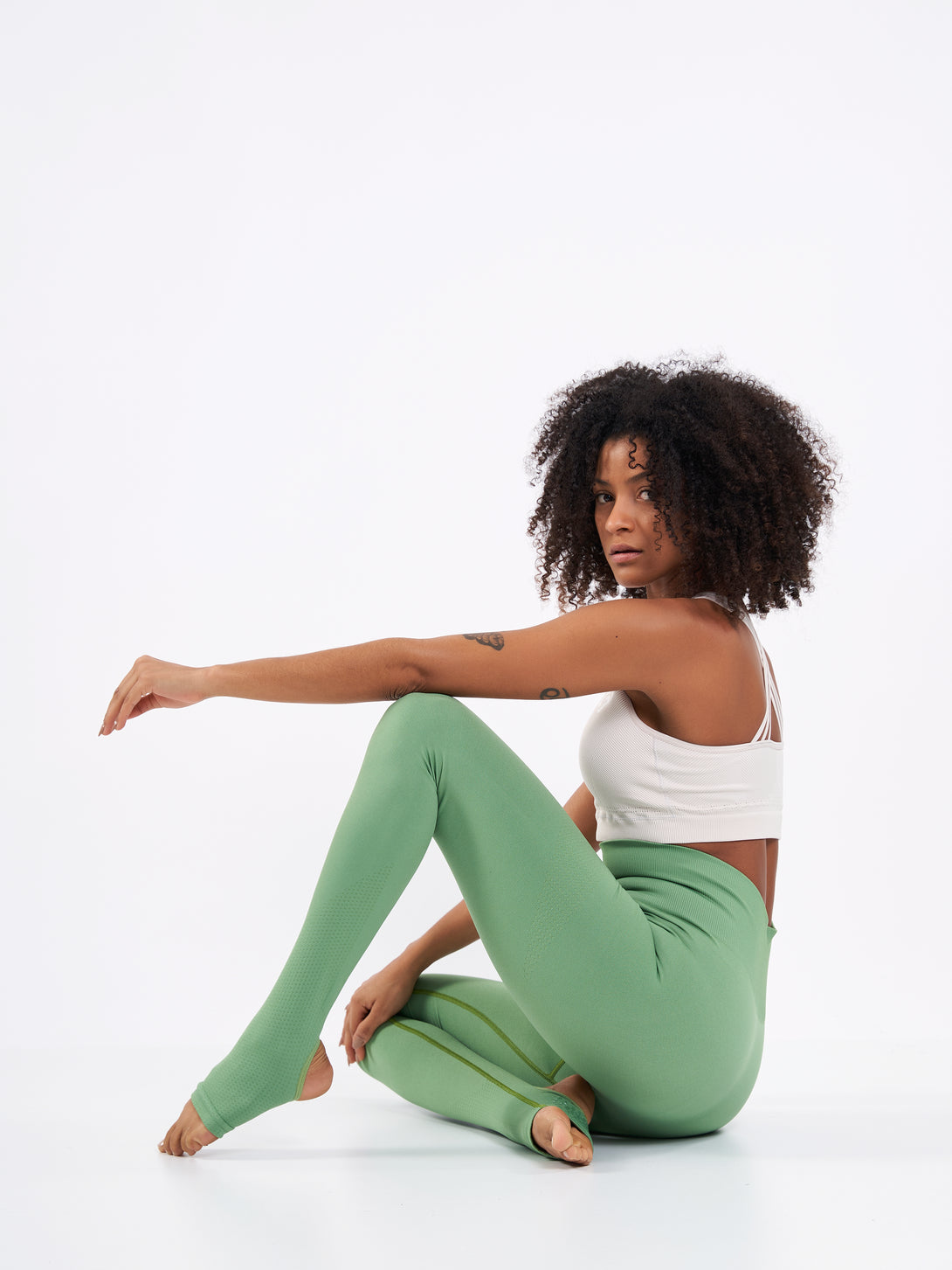 A Woman Wearing Mist Green Color Seamless High-Waist Anti-Slip Yoga Leggings. Super Flexible