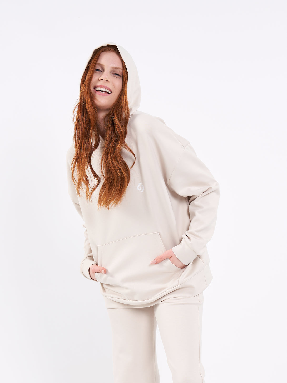 A Woman Wearing White Sand Color Durable Oversized Comfort Hoodie for All-Day Wear