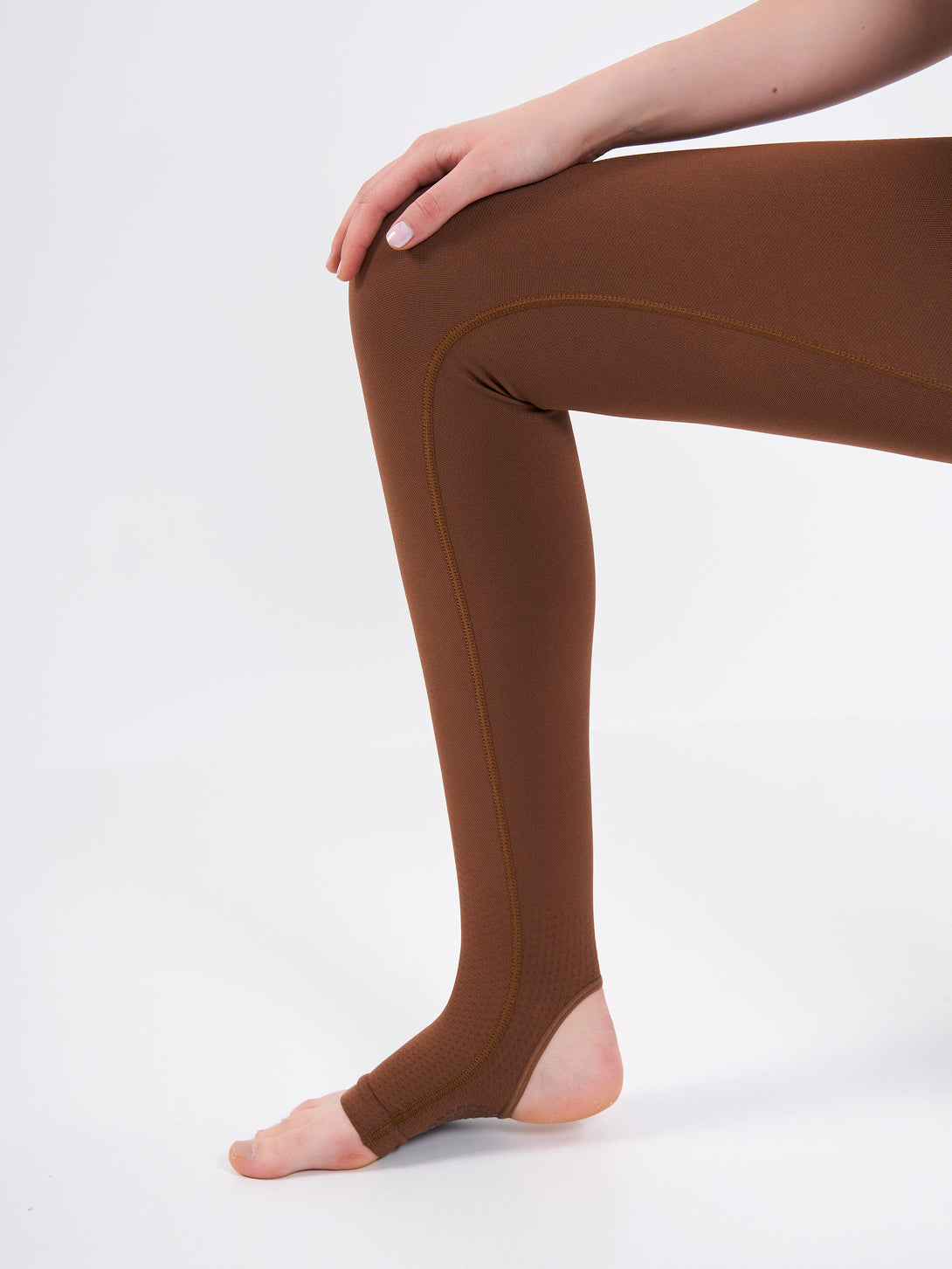 A Woman Wearing Toffe Brown Color Seamless High-Waist Anti-Slip Yoga Leggings. Super Flexible