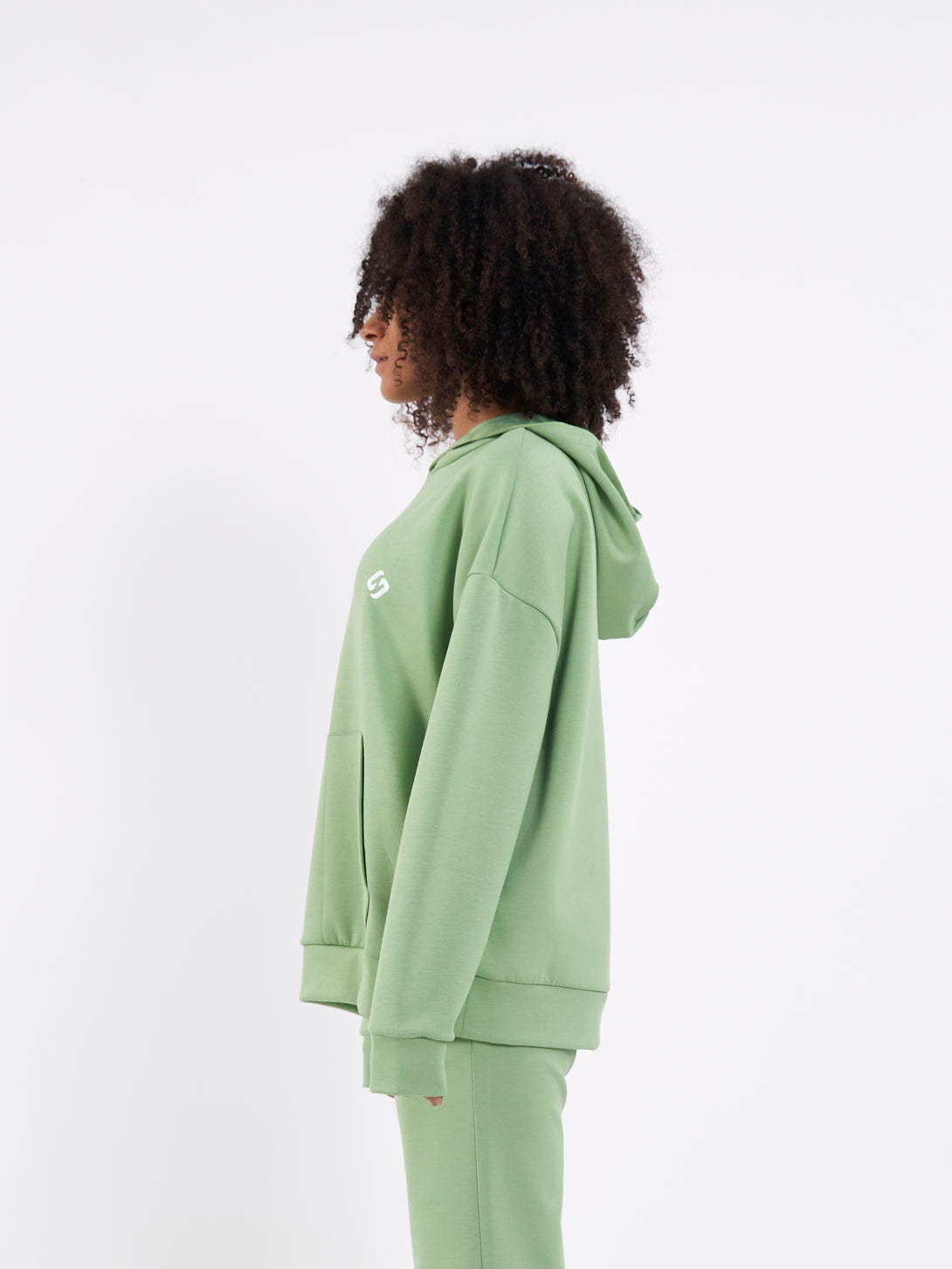 A Woman Wearing Mist Green Color Durable Oversized Comfort Hoodie for All-Day Wear