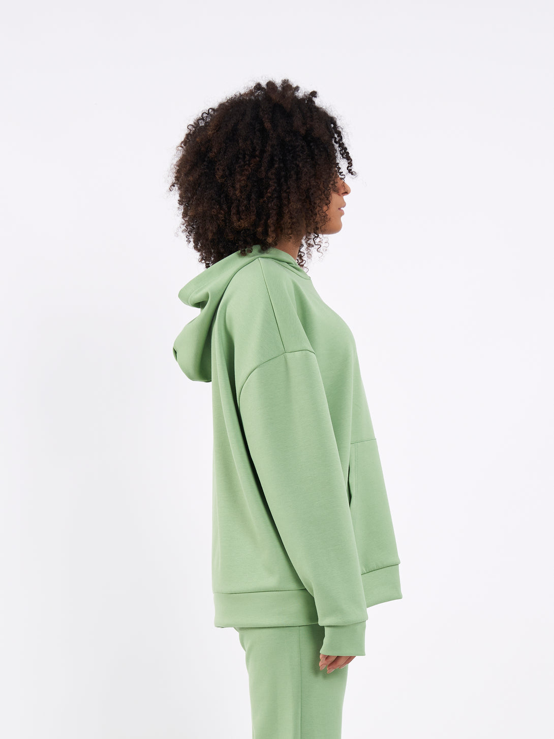 A Woman Wearing Mist Green Color Durable Oversized Comfort Hoodie for All-Day Wear