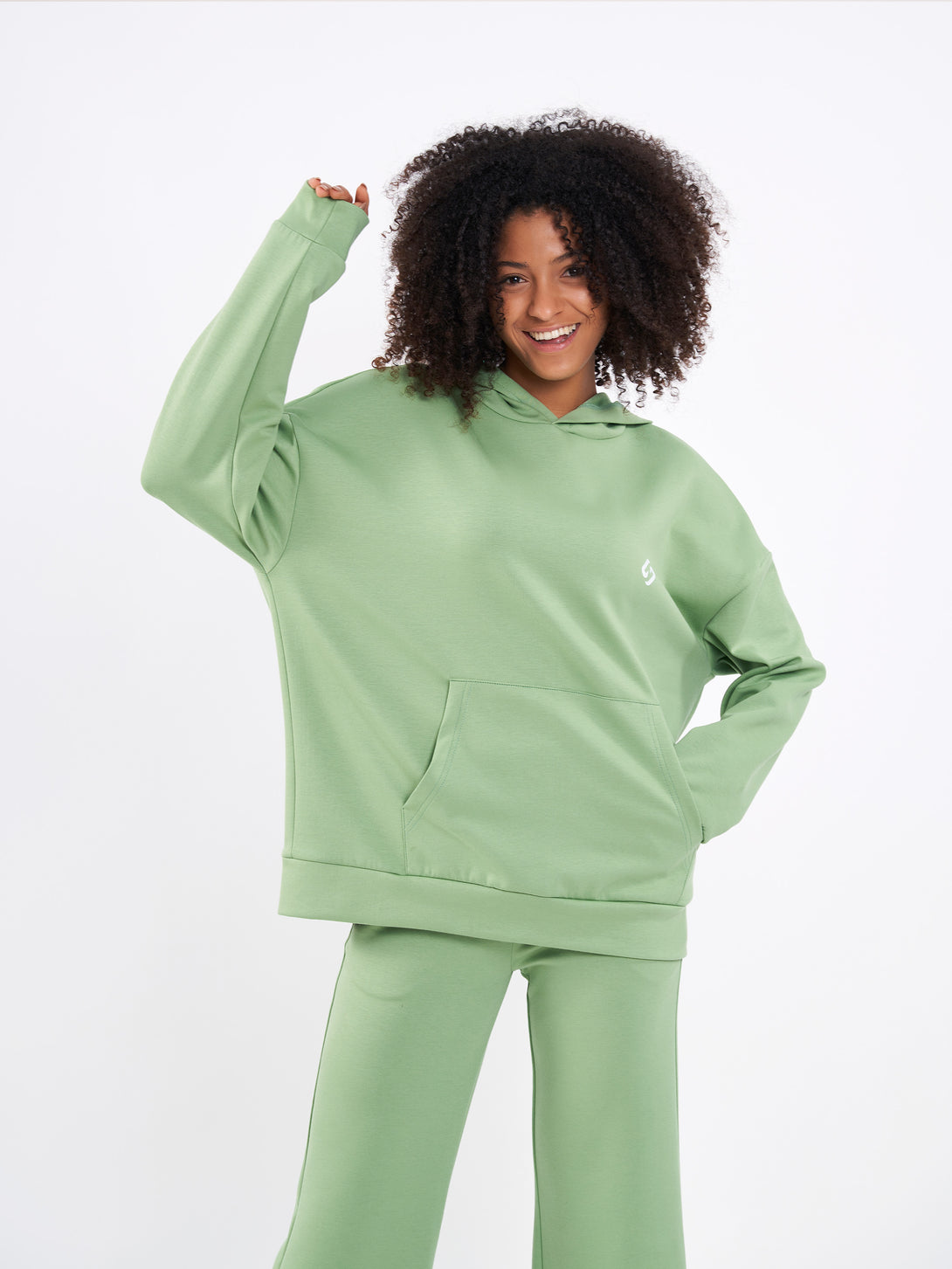 A Woman Wearing Mist Green Color Durable Oversized Comfort Hoodie for All-Day Wear