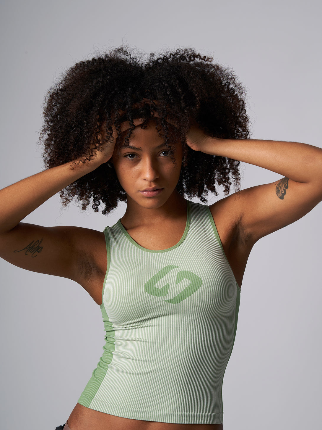 A Woman Wearing Mist GreenColor Easy-Move Seamless Ribbed Crop Top for All-Day Wear