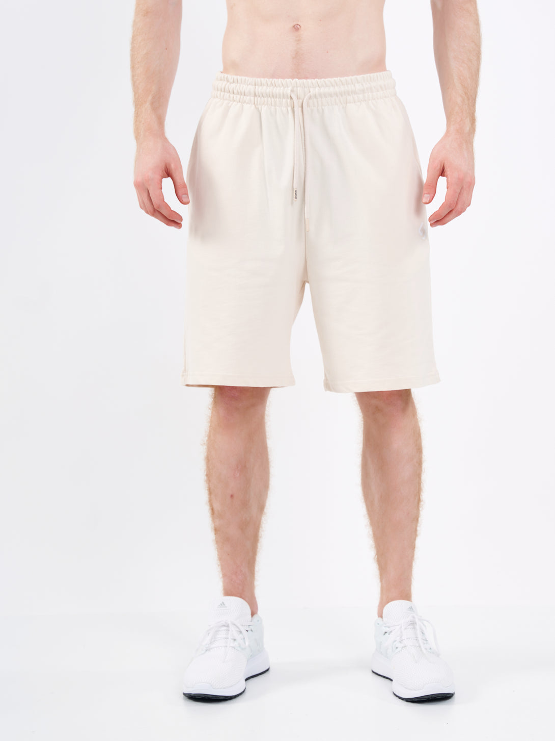 A Man Wearing White Sand Color Men's Easy-Fit Shorts for All-Day Wear