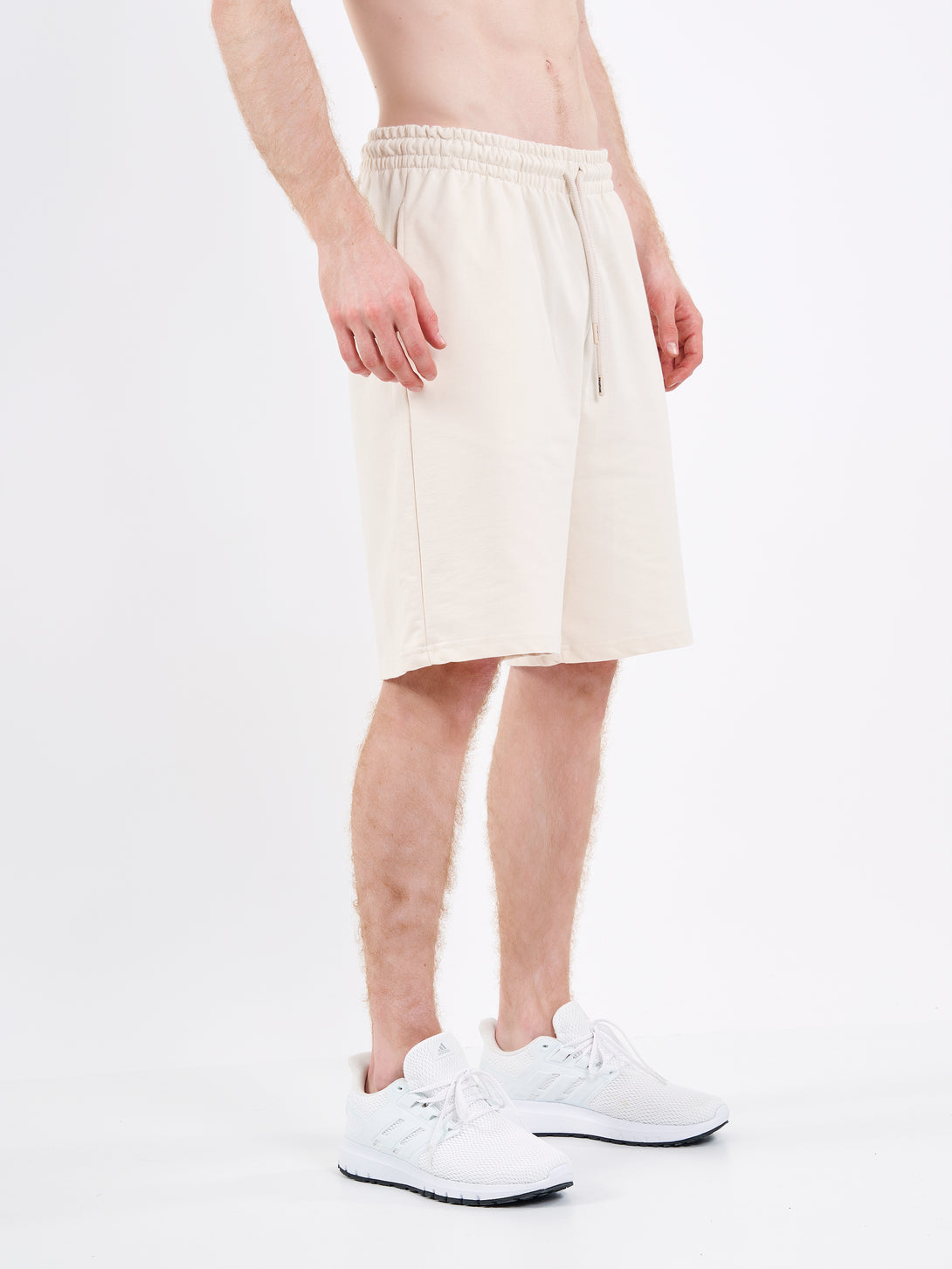 A Man Wearing White Sand Color Men's Easy-Fit Shorts for All-Day Wear
