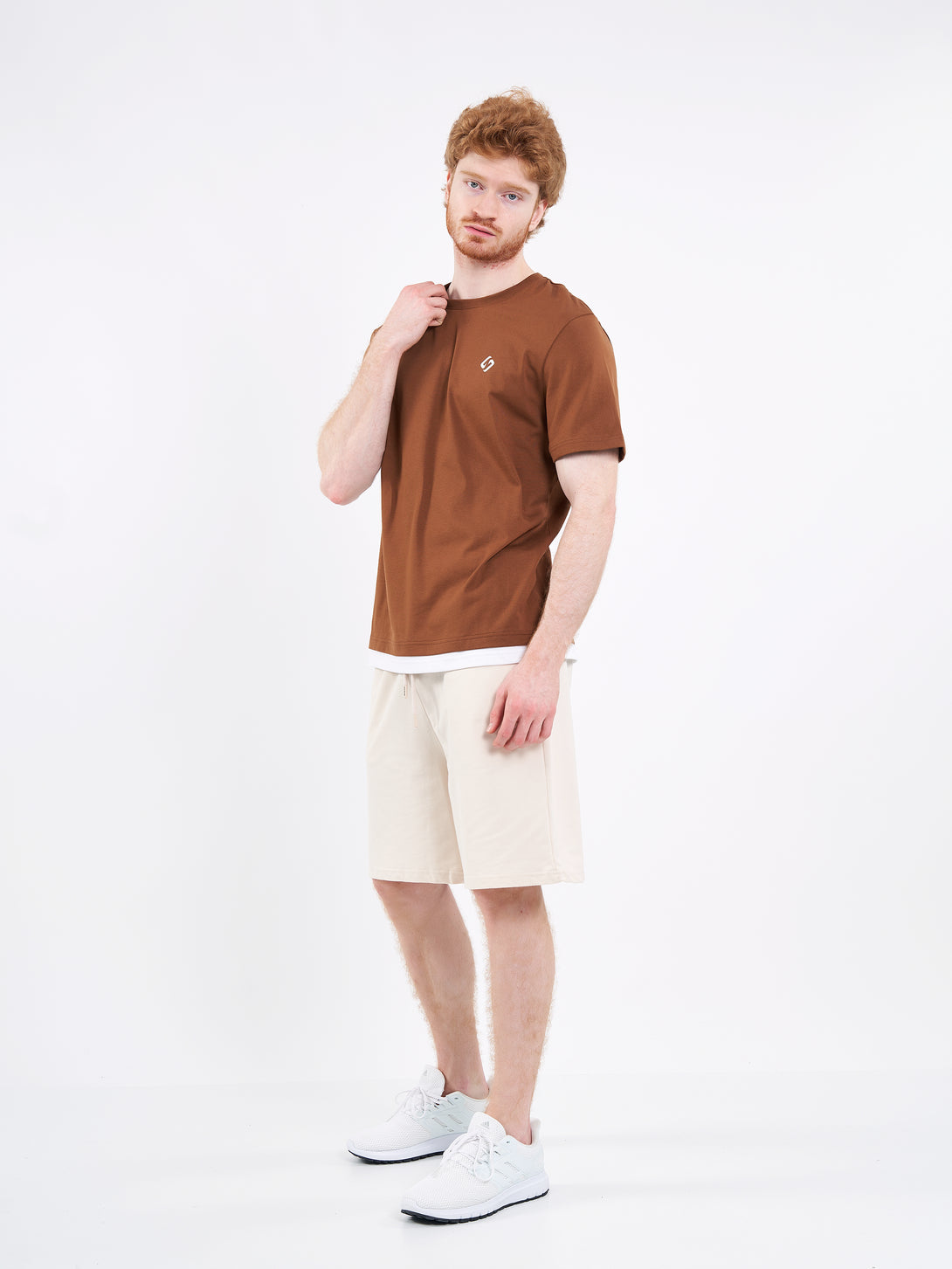 A Man Wearing White Sand Color Men's Easy-Fit Shorts for All-Day Wear