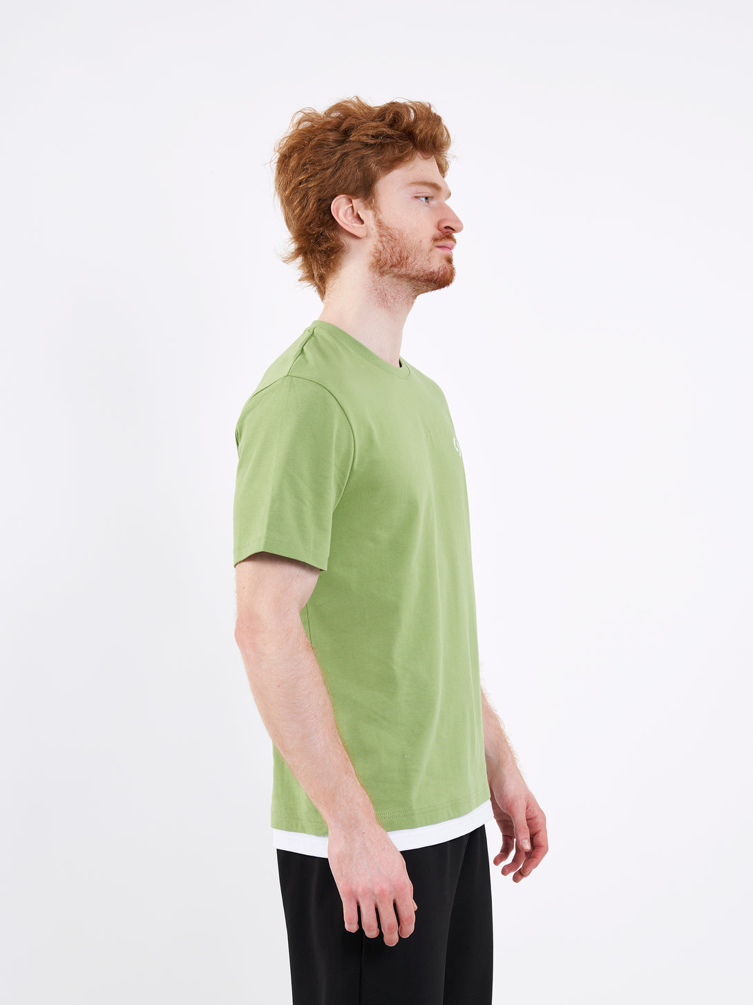 A Man Wearing Mist Green Color Men's Layered Heavyweight Crew Neck T-Shirt. Regular Fit