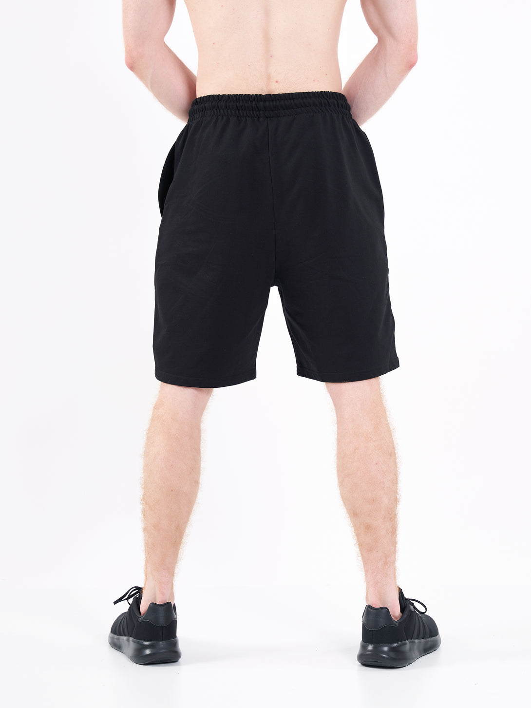 A Man Wearing Deep Black Color Men's Easy-Fit Shorts for All-Day Wear