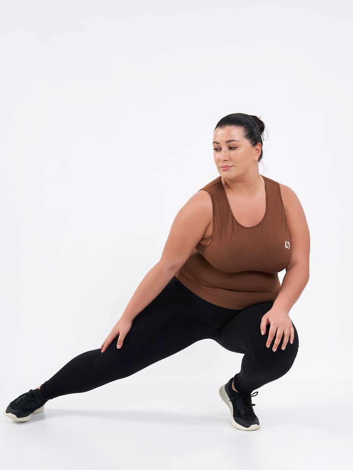 A Women Wearing Black Beauty Color Zen Confidence Seamless Compressive Leggings. Body-Shaping