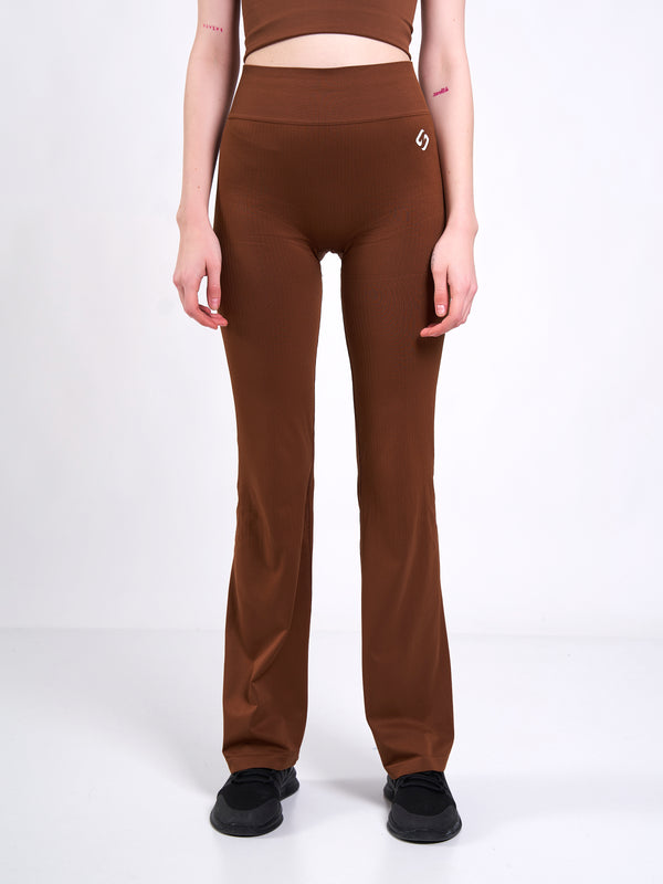 Color_Leather Brown | A Woman Wearing Toffee Color Antigravity Seamless Flare-Leg Yoga Pants. Ultra-Light