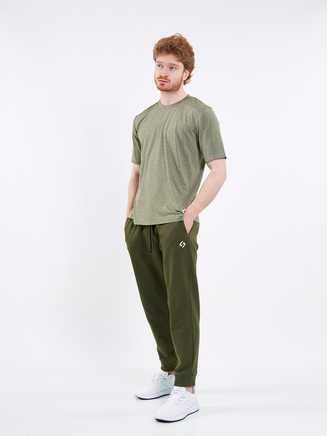 A Man Wearing Zen Khaki Color Men's Essential Comfort Joggers. Regular Fit