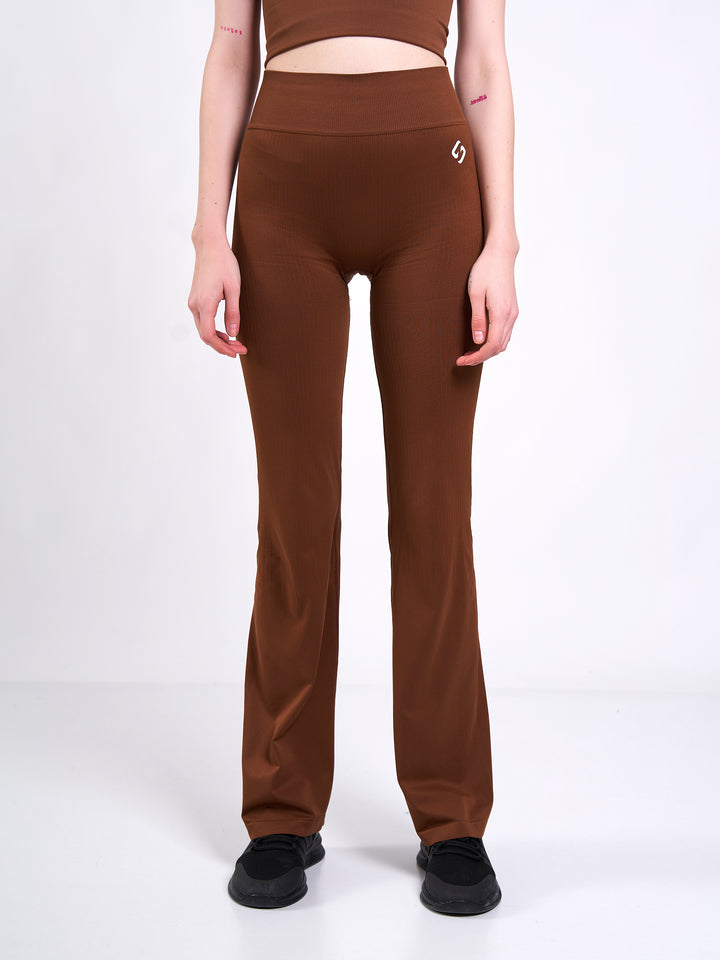 A Woman Wearing Toffee Color Antigravity Seamless Flare-Leg Yoga Pants. Ultra-Light