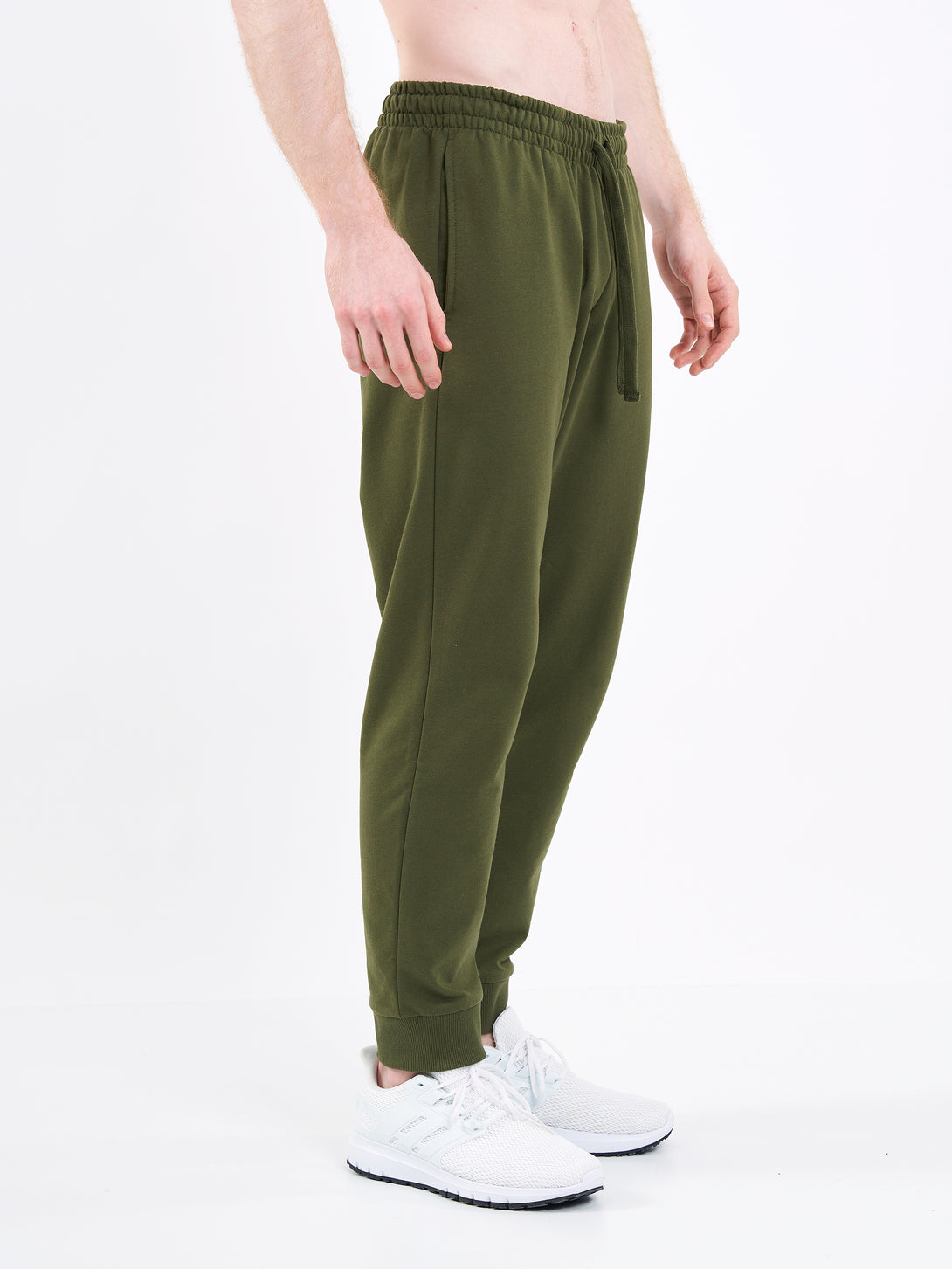 A Man Wearing Zen Khaki Color Men's Essential Comfort Joggers. Regular Fit