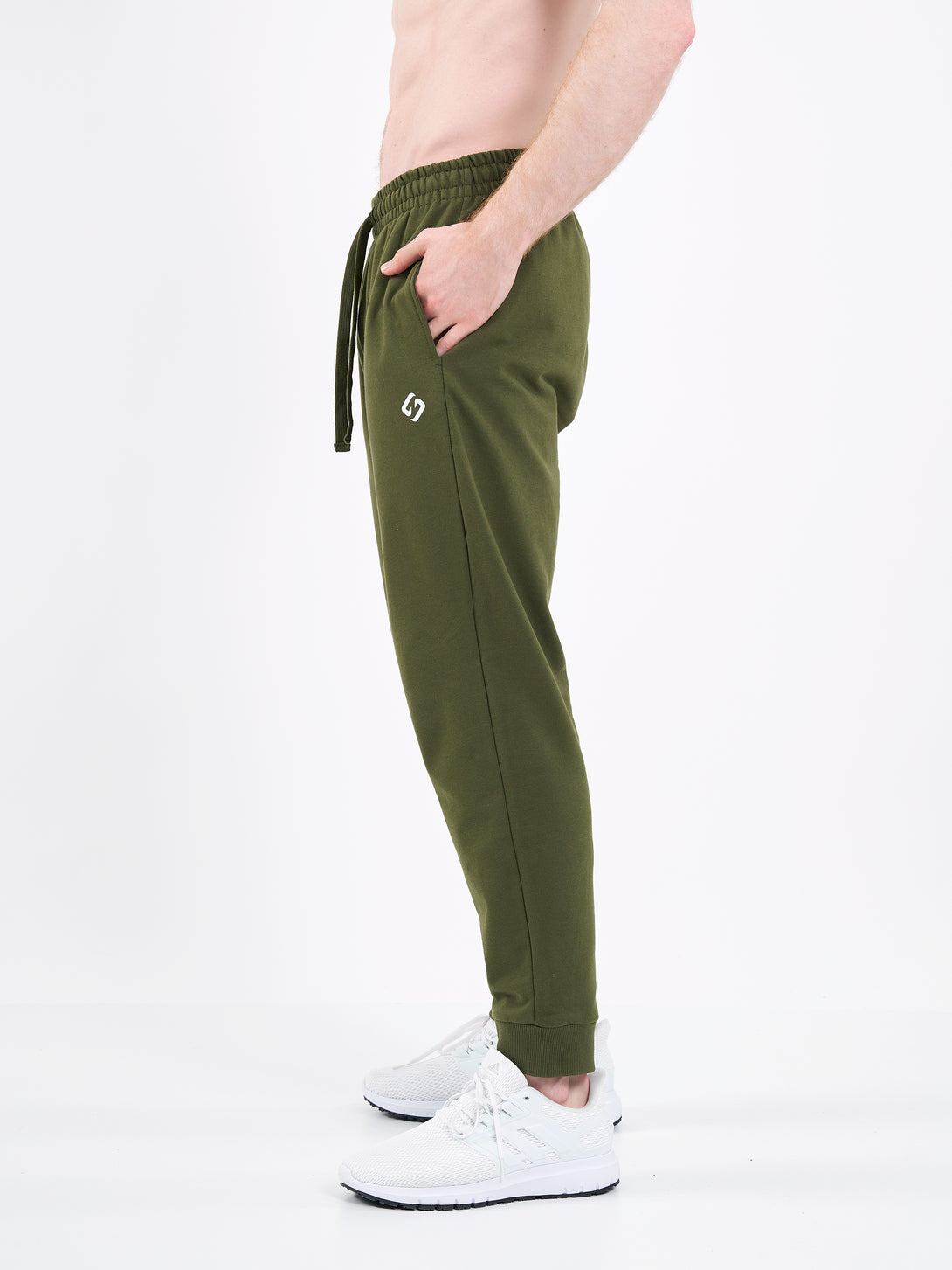 A Man Wearing Zen Khaki Color Men's Essential Comfort Joggers. Regular Fit