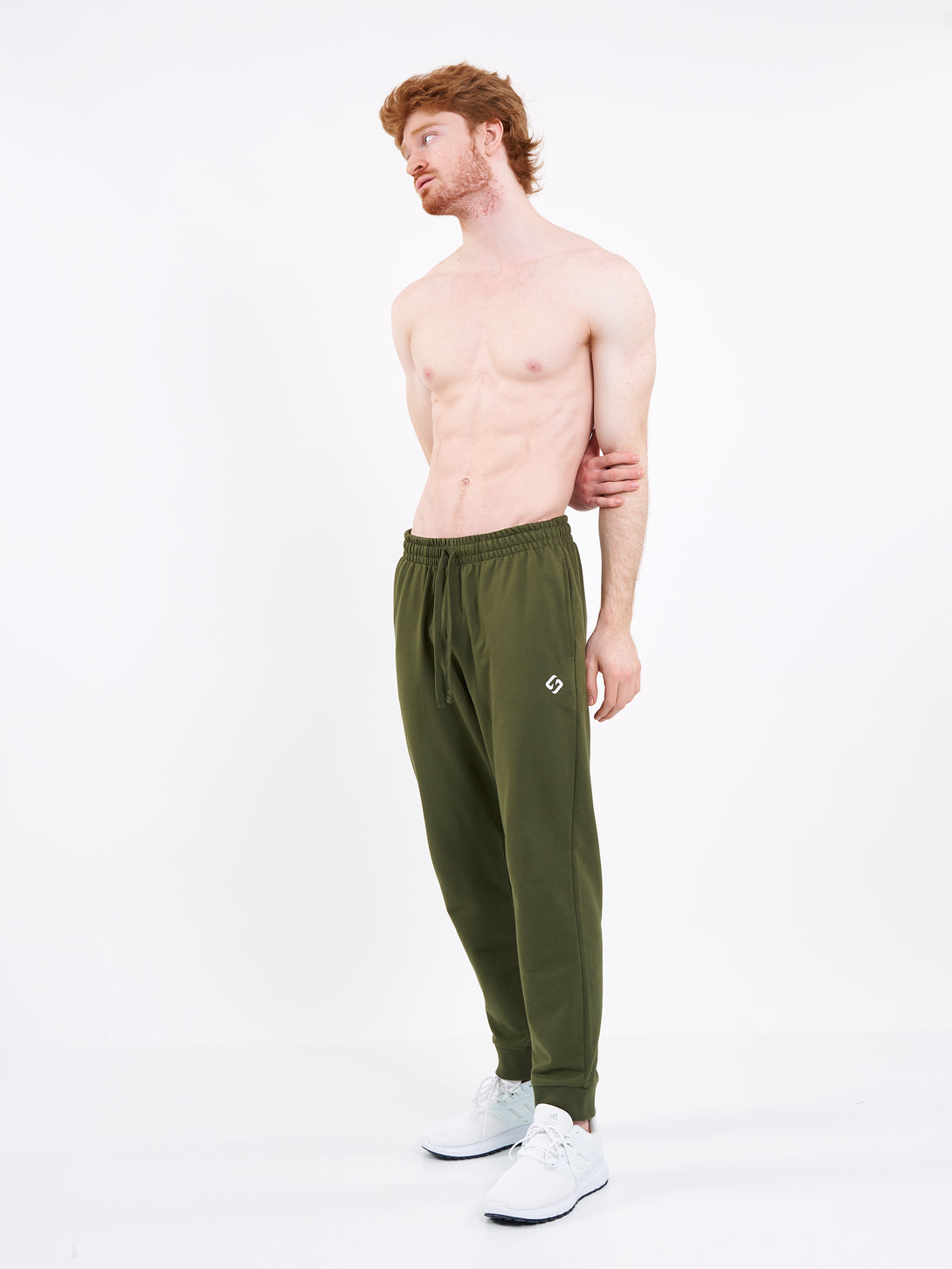 A Man Wearing Zen Khaki Color Men's Essential Comfort Joggers. Regular Fit