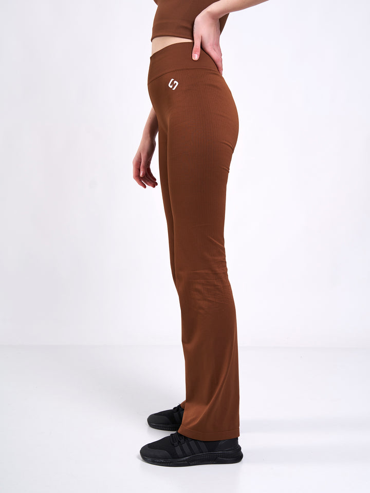 A Woman Wearing Toffee Color Antigravity Seamless Flare-Leg Yoga Pants. Ultra-Light