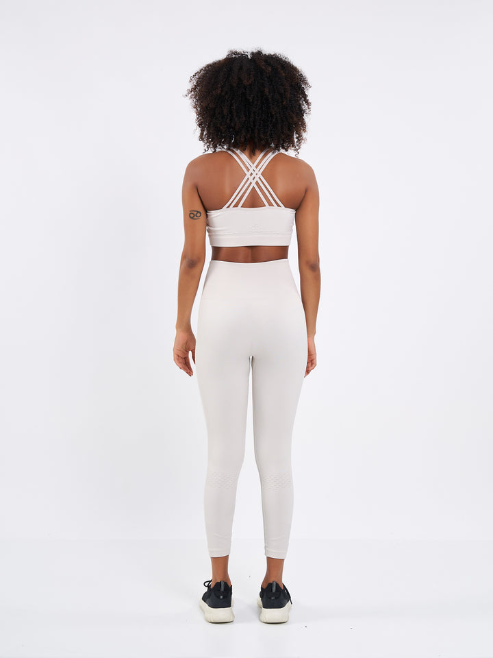 A Woman Wearing Sand Dune Color Seamless High-Waist Ankle-Length Ribbed Leggings. Super-Soft