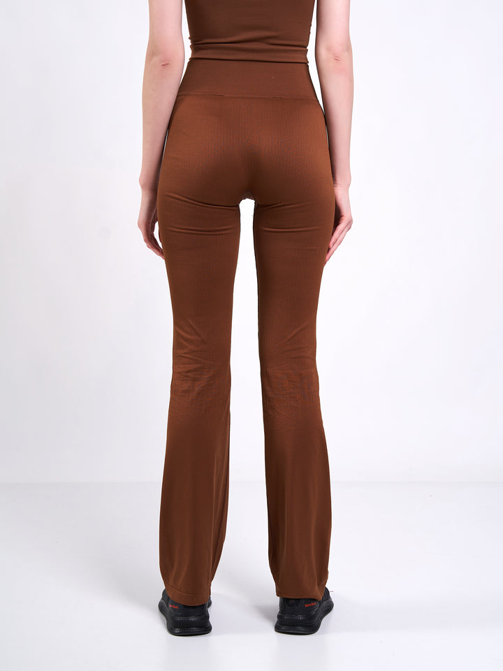 A Woman Wearing Toffee Color Antigravity Seamless Flare-Leg Yoga Pants. Ultra-Light