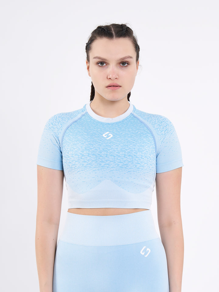 A Woman Wearing Mountain High Color Seamless Crop Top with Ombre Effect. Chic Comfort