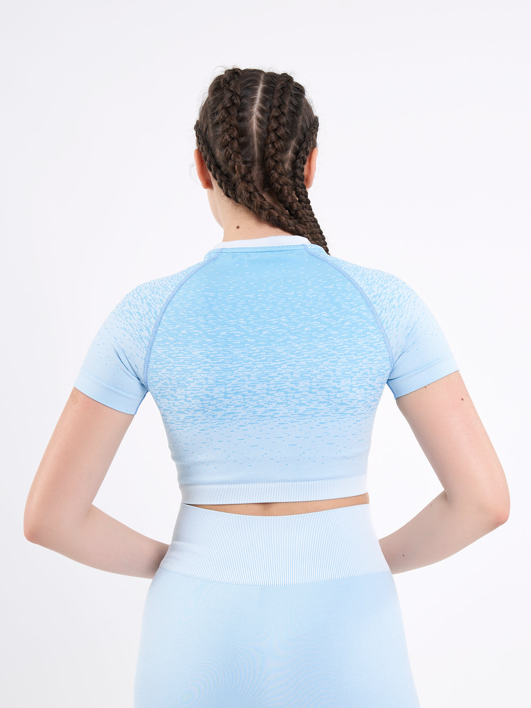 A Woman Wearing Sky Blue Color Seamless Crop Top with Ombre Effect. Chic Comfort