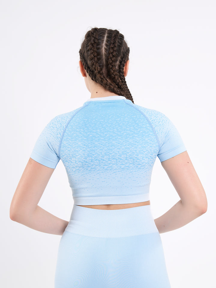 A Woman Wearing Mountain High Color Seamless Crop Top with Ombre Effect. Chic Comfort