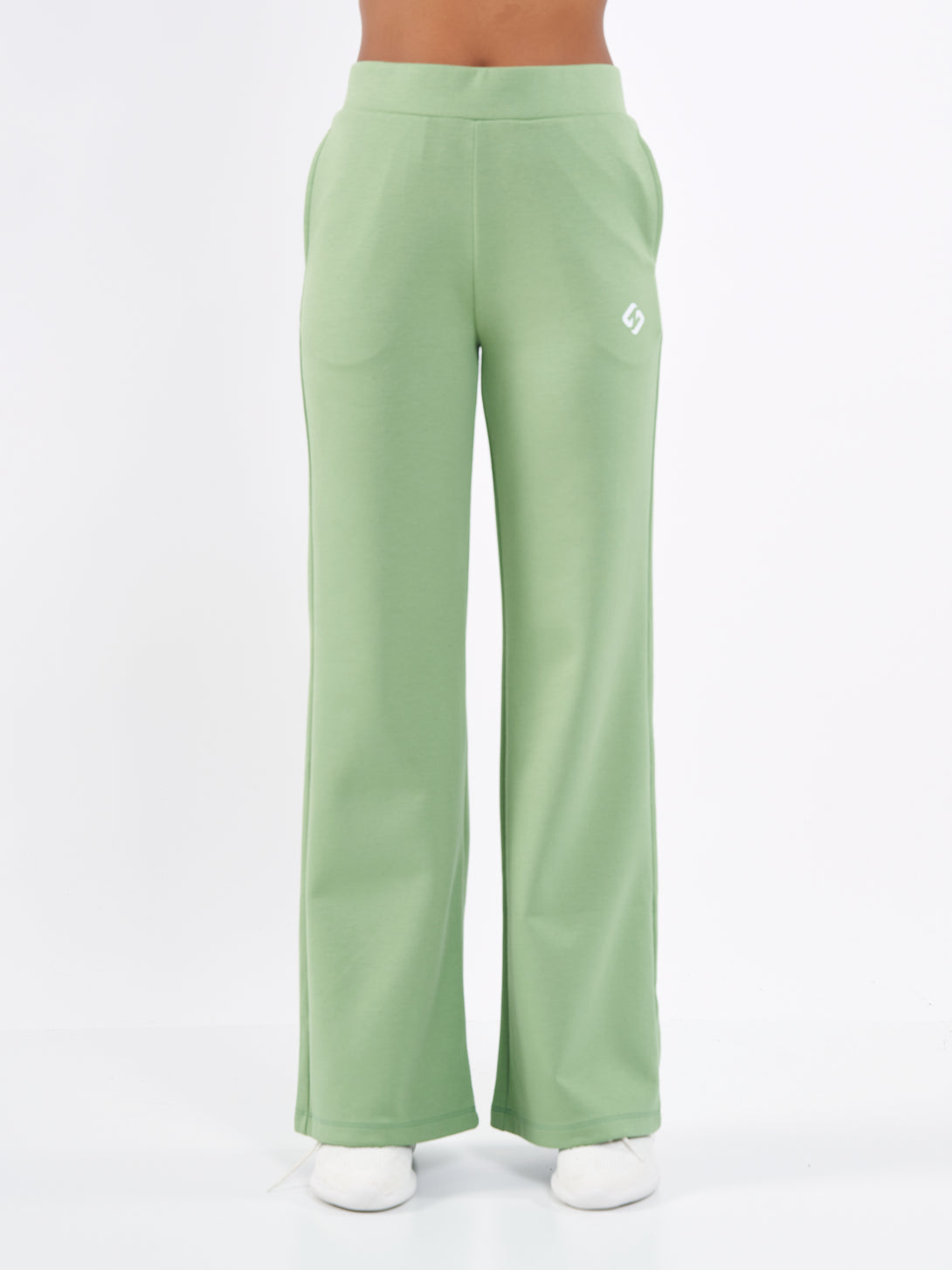 A Woman Wearing Mist Green Color Durable Flare-Leg Comfort Joggers for All-Day Wear