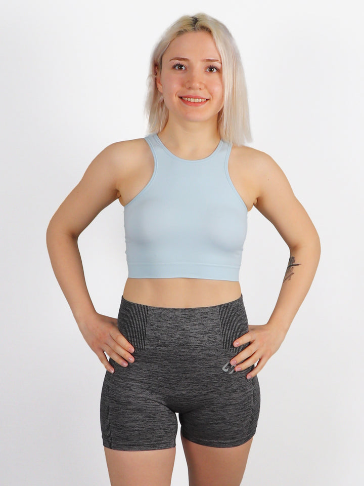 A Woman Wearing Clear Skies Color All-Day Seamless Sleeveless Crop Top