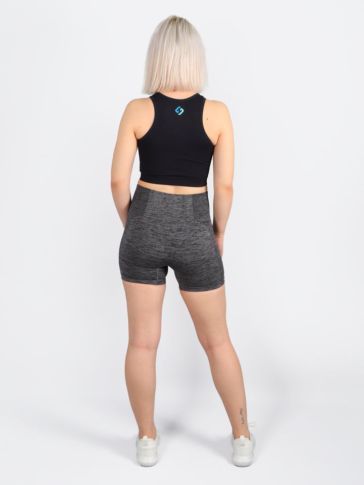 A Woman Wearing Black Color All-Day Seamless Sleeveless Crop Top