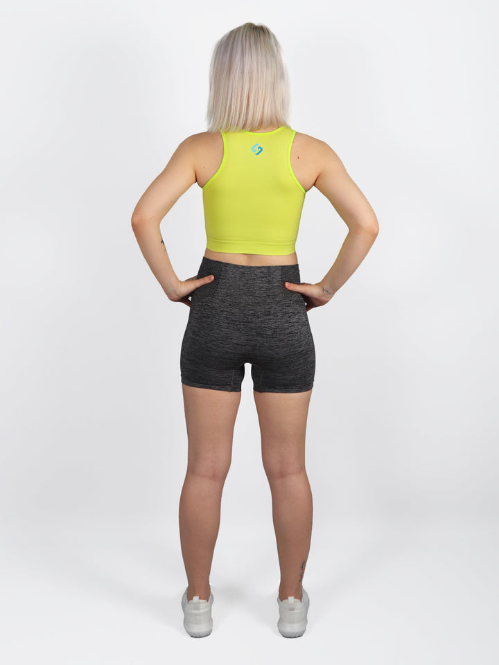 A Woman Wearing Limeade Color All-Day Seamless Sleeveless Crop Top