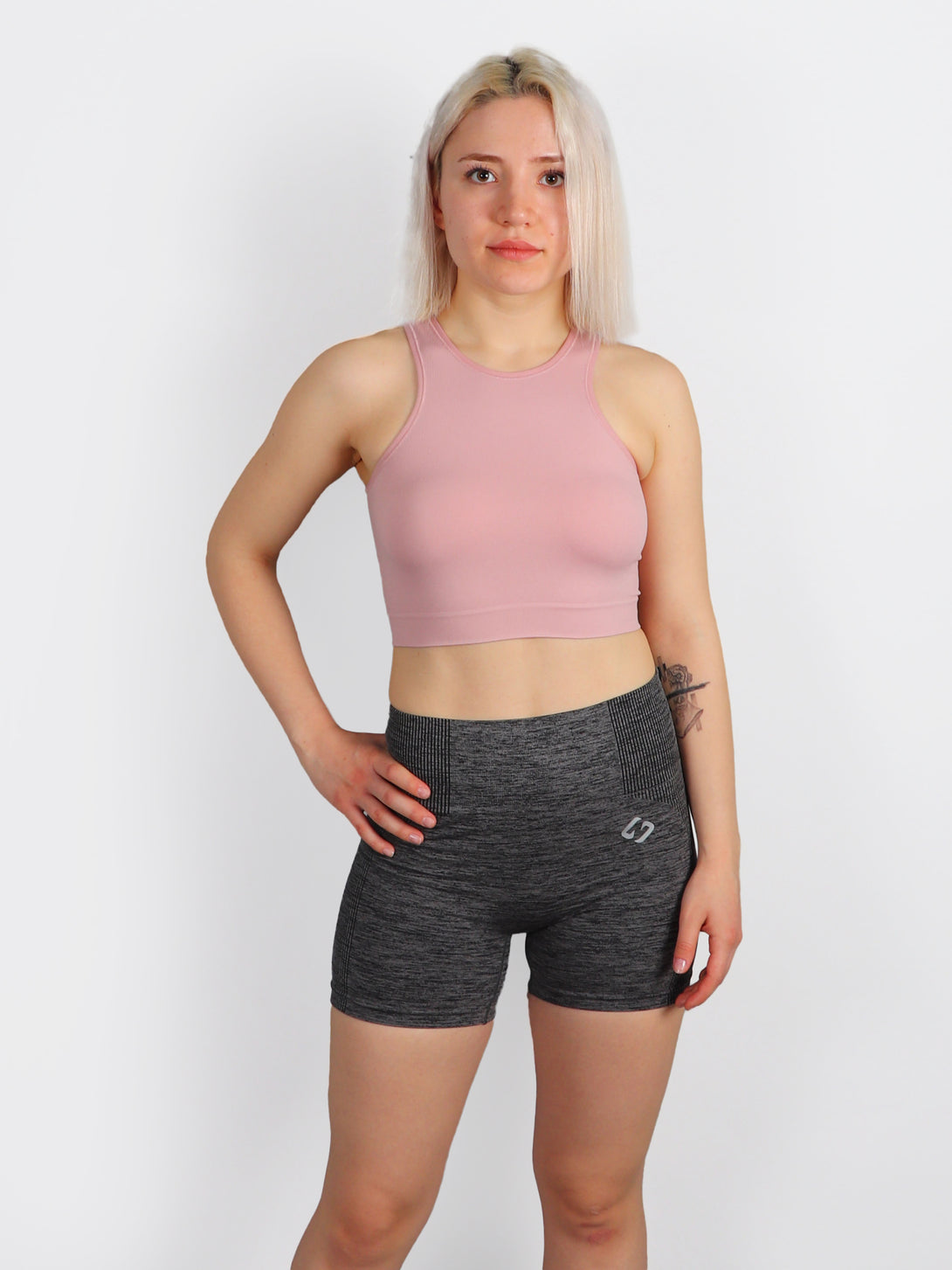 A Woman Wearing Pale Mauve Color All-Day Seamless Sleeveless Crop Top