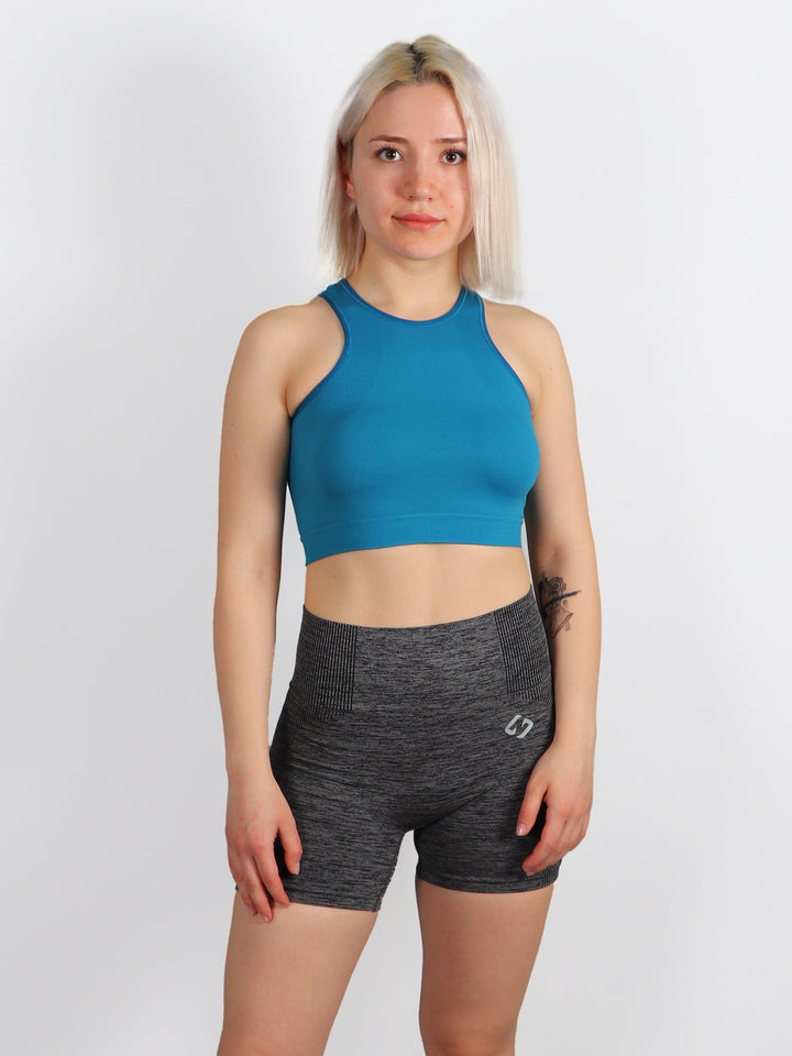 A Woman Wearing Blue Lagoon Color All-Day Seamless Sleeveless Crop Top