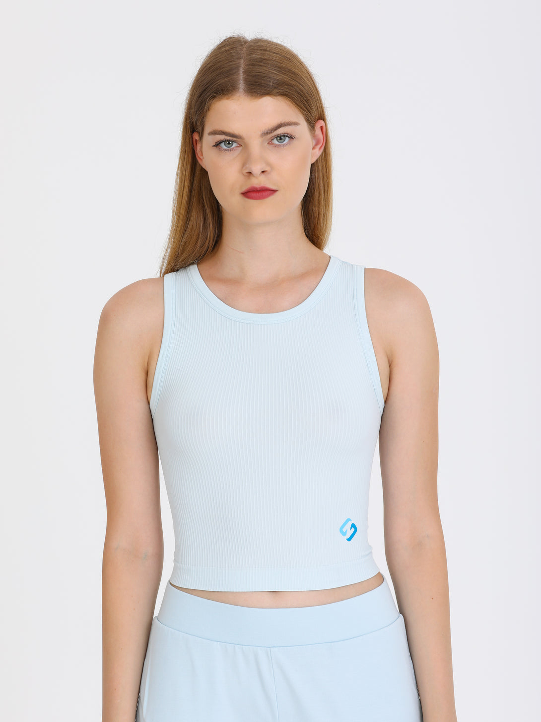 A Woman Wearing Baby Blue Color All-Day Sleeveless Strapped Crop Top