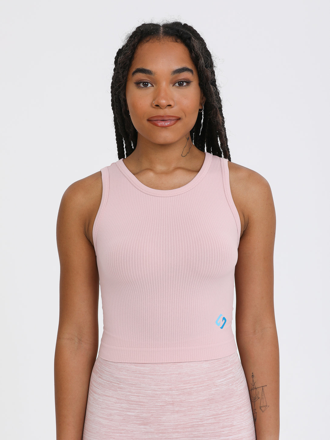 A Woman Wearing Pale Mauve Color All-Day Sleeveless Strapped Crop Top