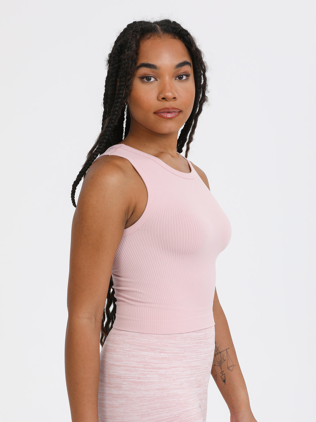 A Woman Wearing Pale Mauve Color All-Day Sleeveless Strapped Crop Top