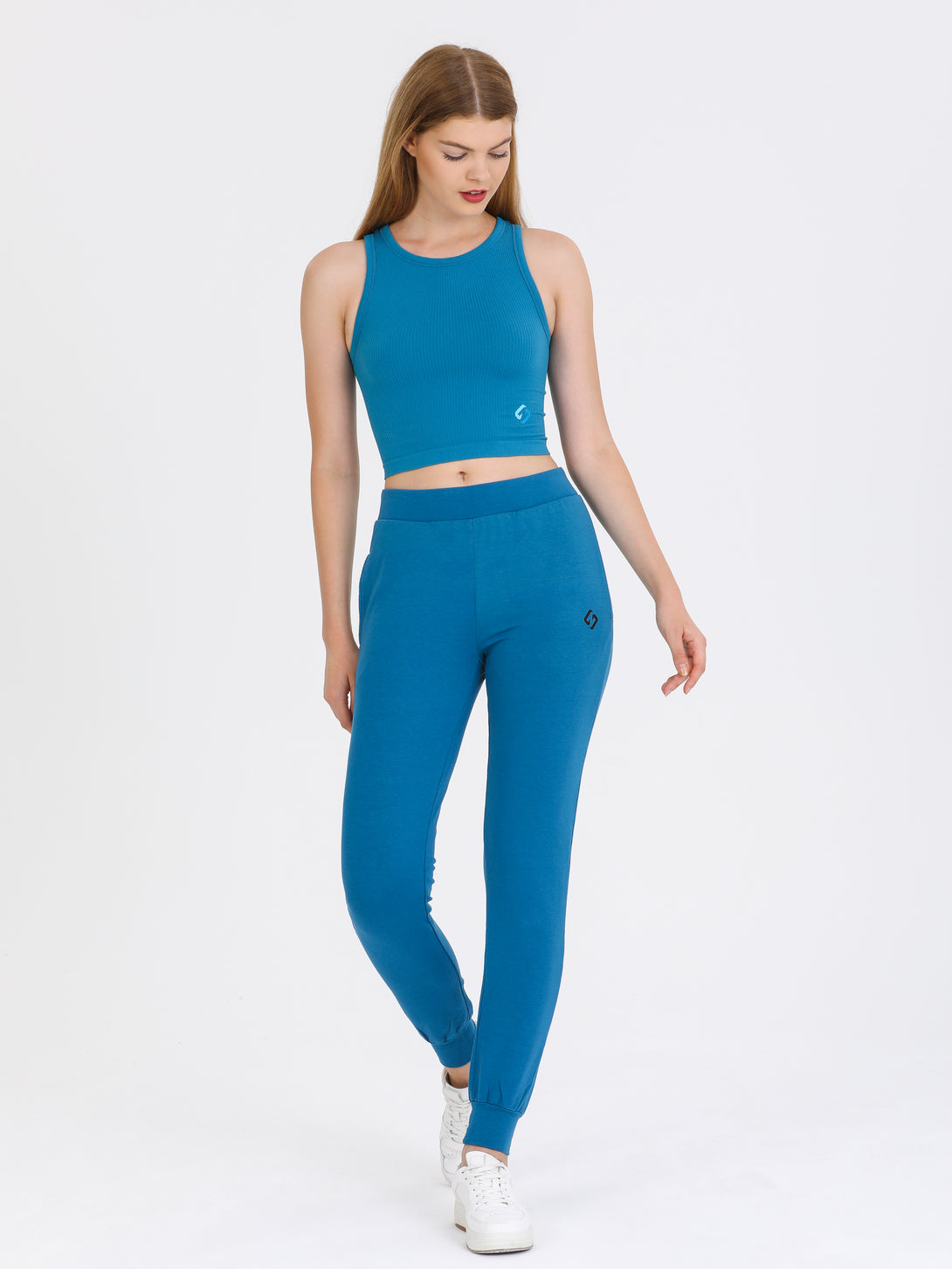A Woman Wearing Saxony Blue Color All-Day Sleeveless Strapped Crop Top