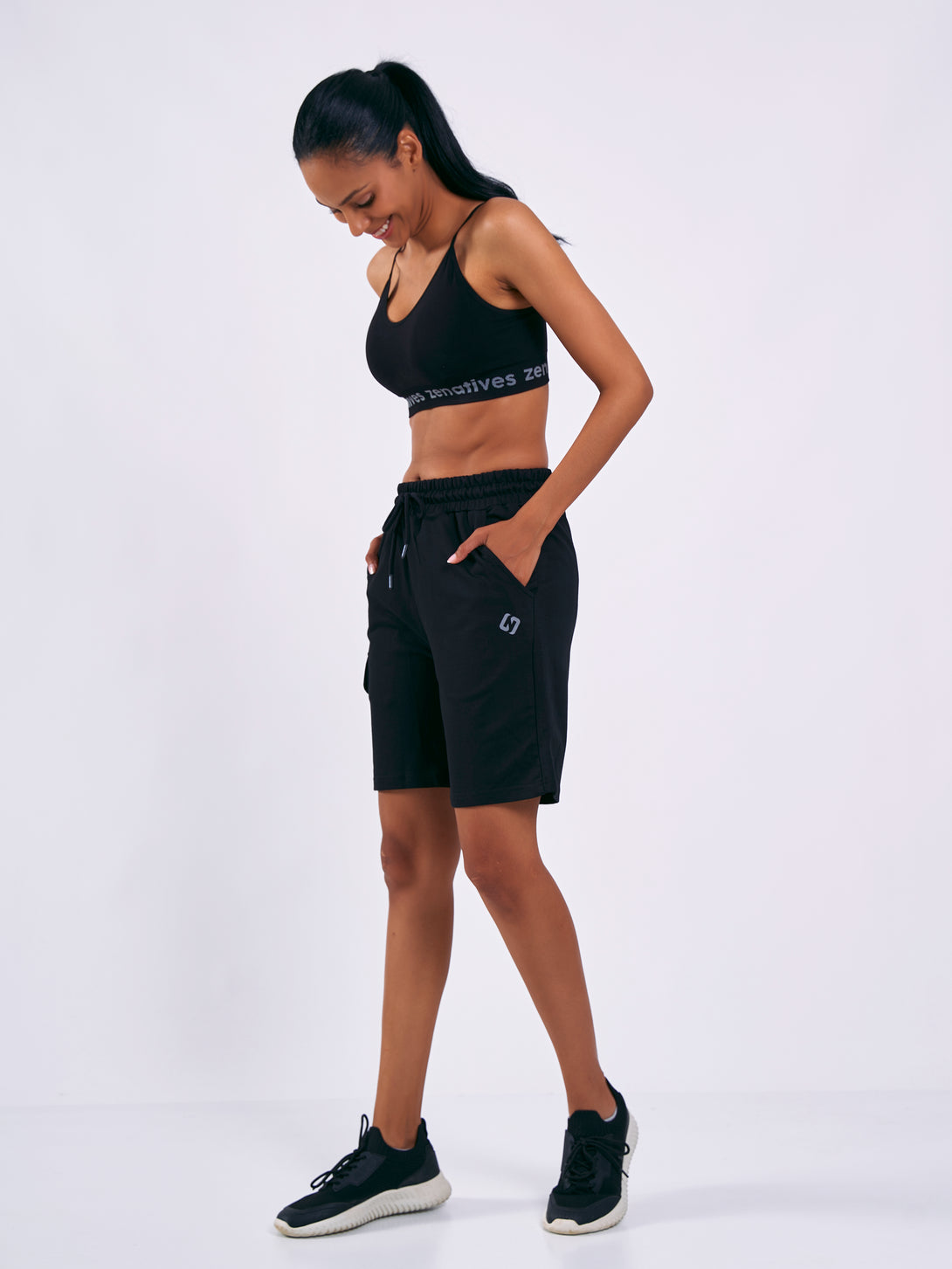 A Woman Wearing Deep Black Color Women Cargo Sweatshort