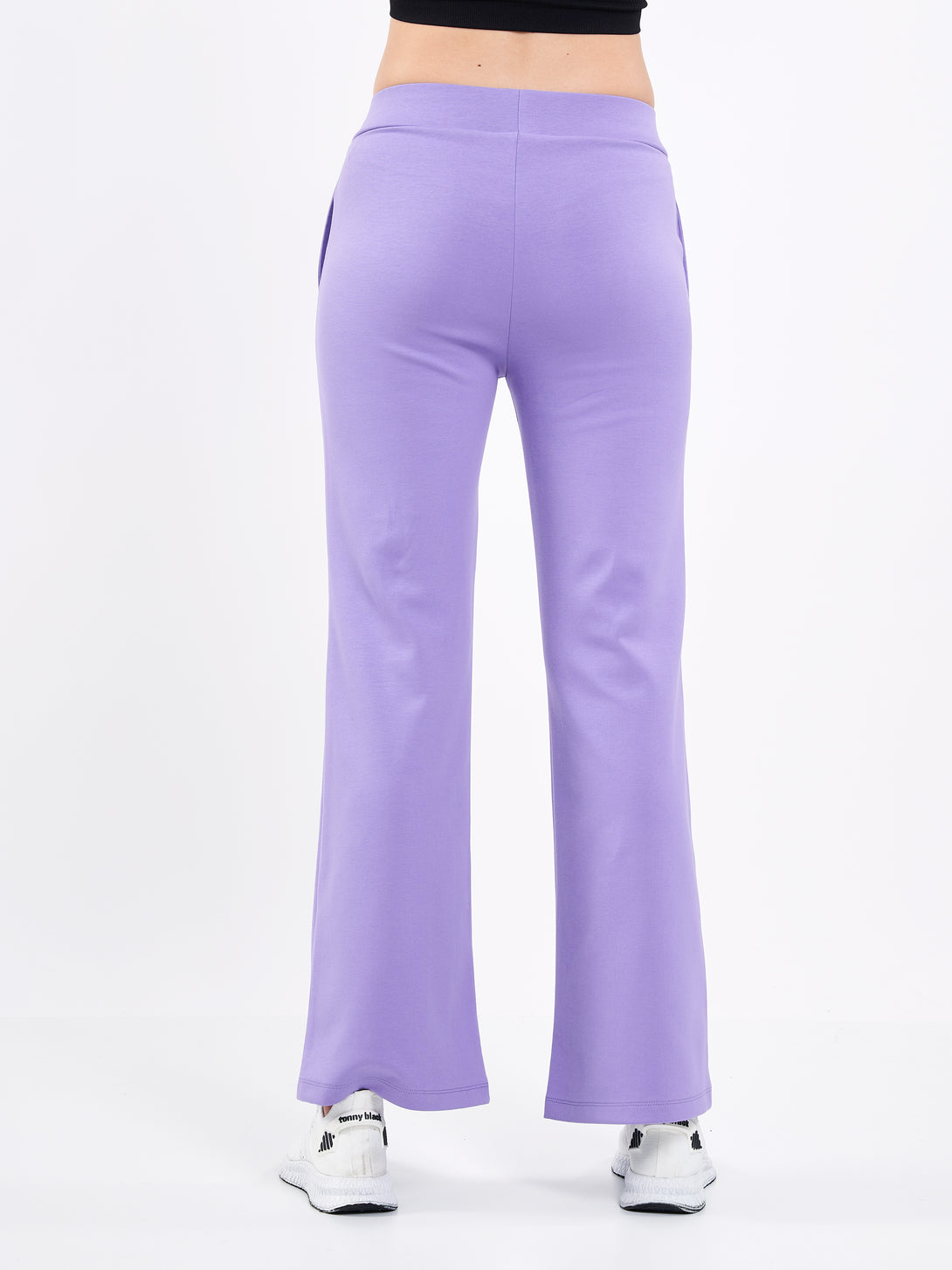 A Woman Wearing Paisley Purple Color Durable Flare-Leg Comfort Joggers for All-Day Wear