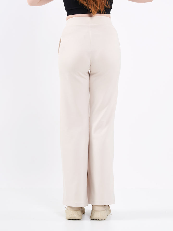 A Woman Wearing White Sand Color Durable Flare-Leg Comfort Joggers for All-Day Wear