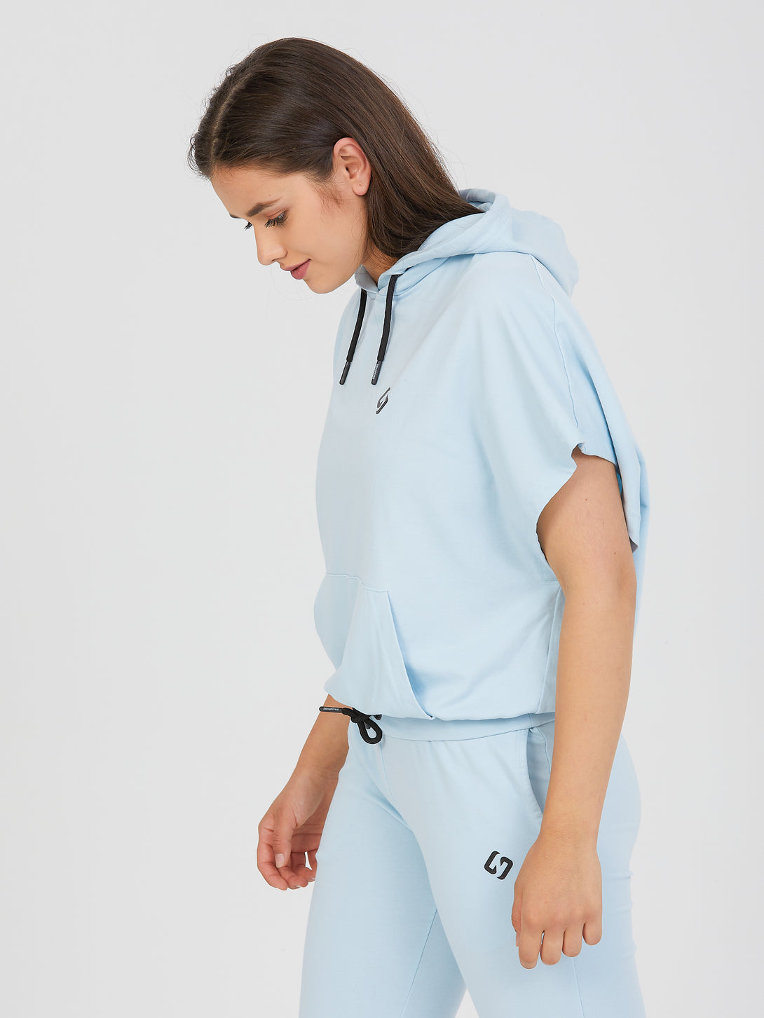 A Woman Wearing Baby Blue Color All-Day Essential Sweatshirt