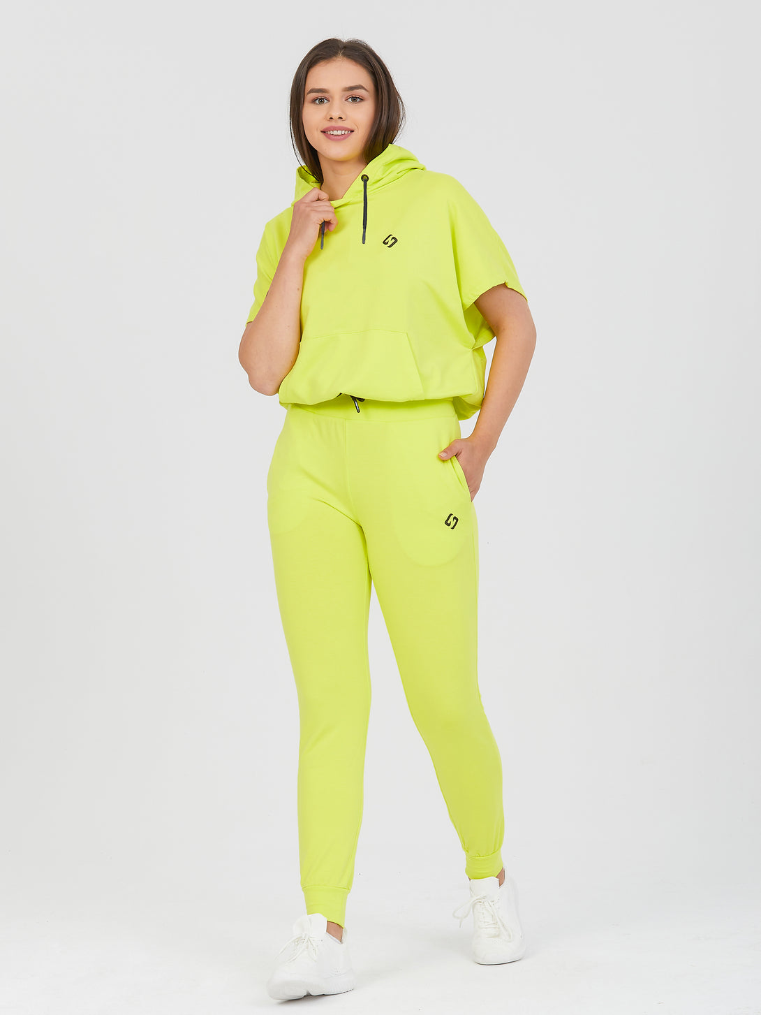 A Woman Wearing Limeade Color All-Day Essential Sweatshirt