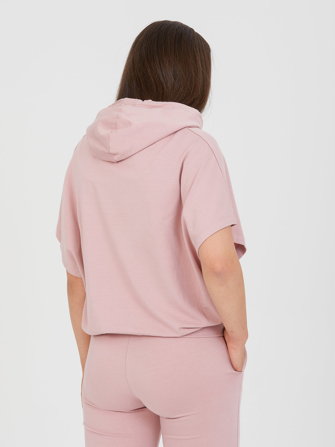 A Woman Wearing Pale Mauve Color All-Day Essential Sweatshirt