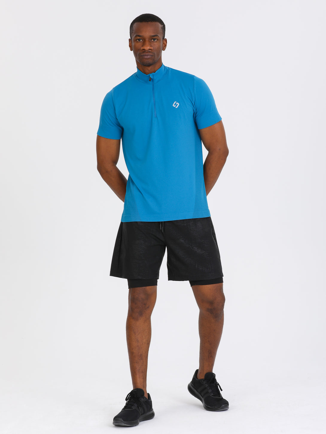A Man Wearing Black Color Double Layered Mens Shorts