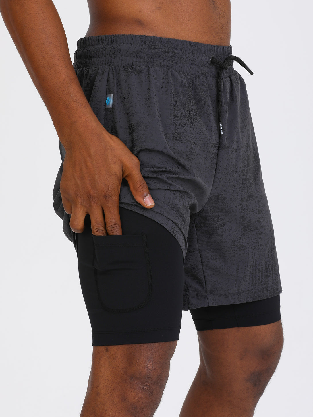 A Man Wearing Light Grey Color Double Layered Mens Shorts