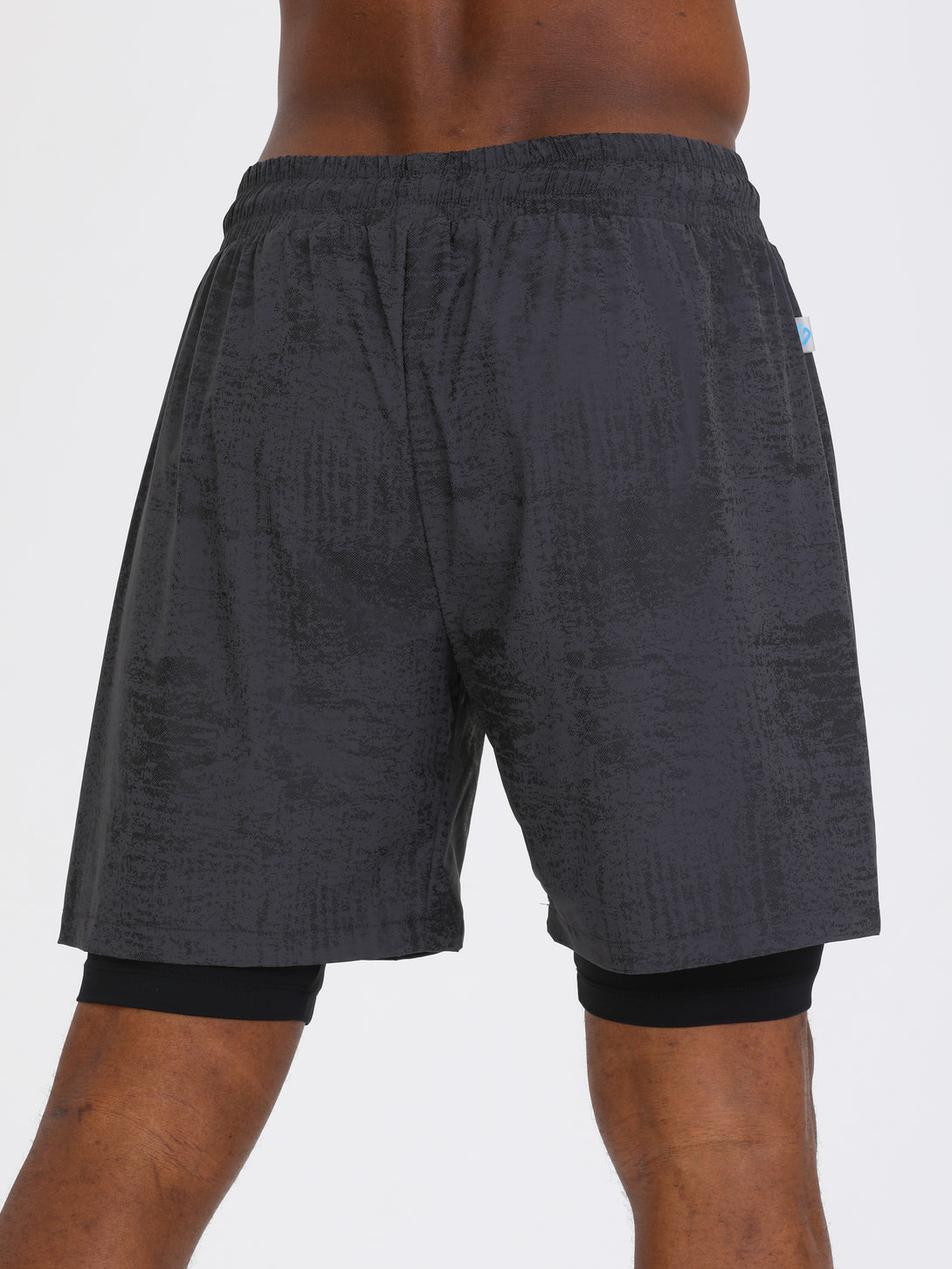 A Man Wearing Light Grey Color Double Layered Mens Shorts
