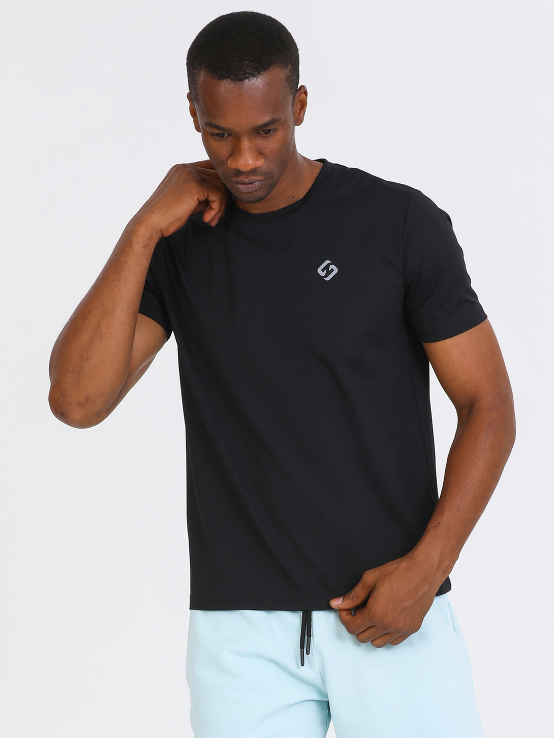 A Man Wearing Black Color Essential Workout T-Shirt