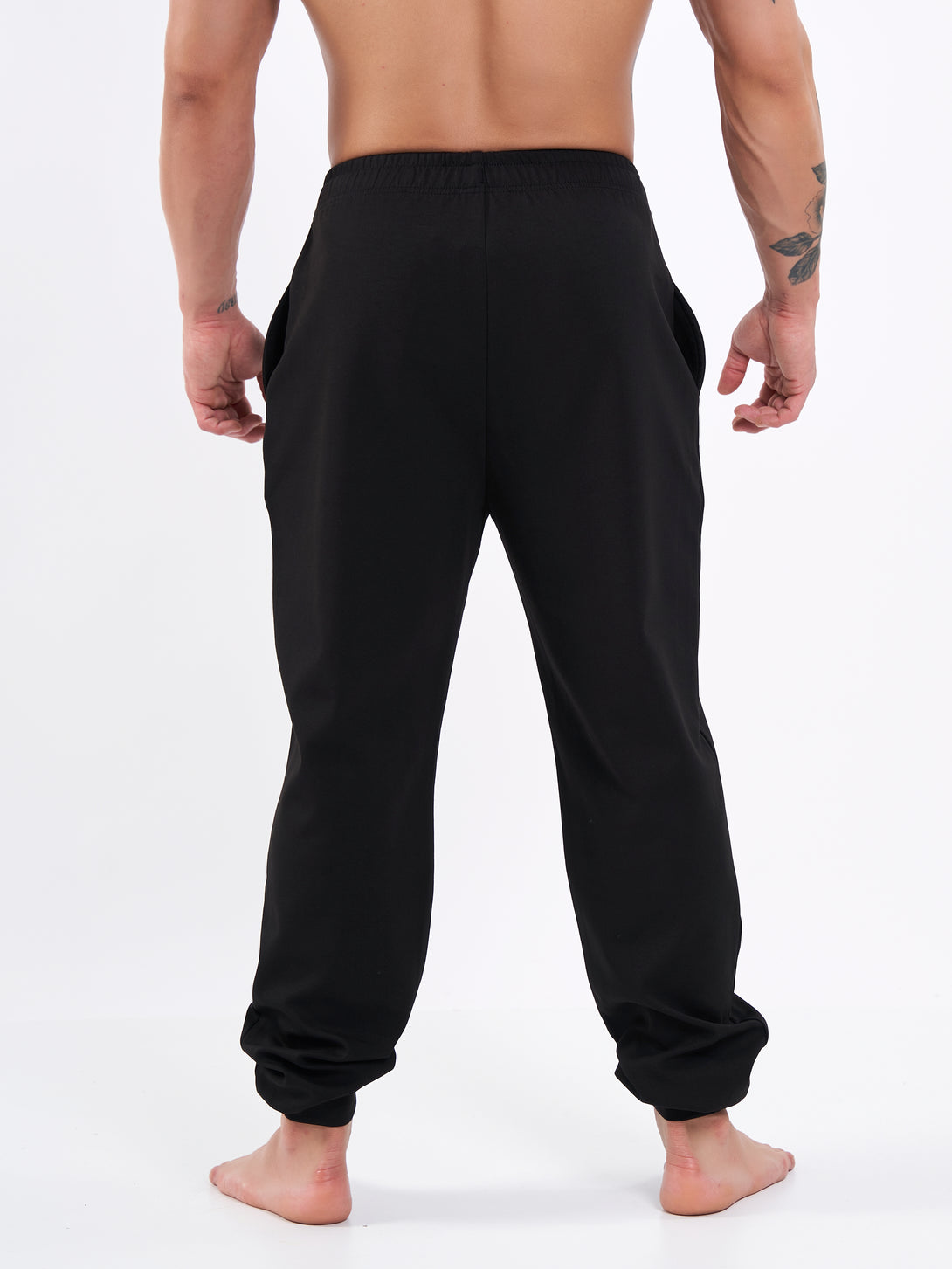 A Man Wearing Deep Black Color Durable Men's Joggers for All-Day Wear
